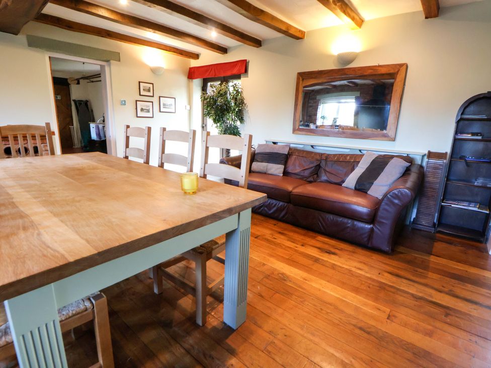 A dining room with a table and chairs at Home Farm St Asaph