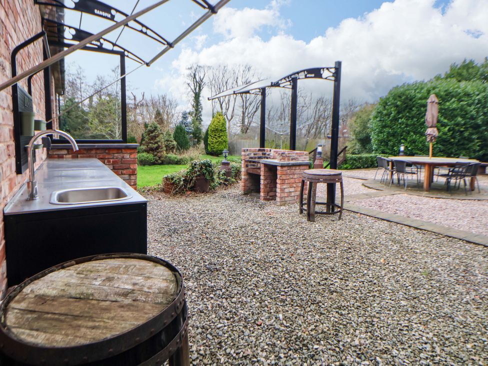 An outdoor area with a sink and barbecue at Home Farm St Asaph
