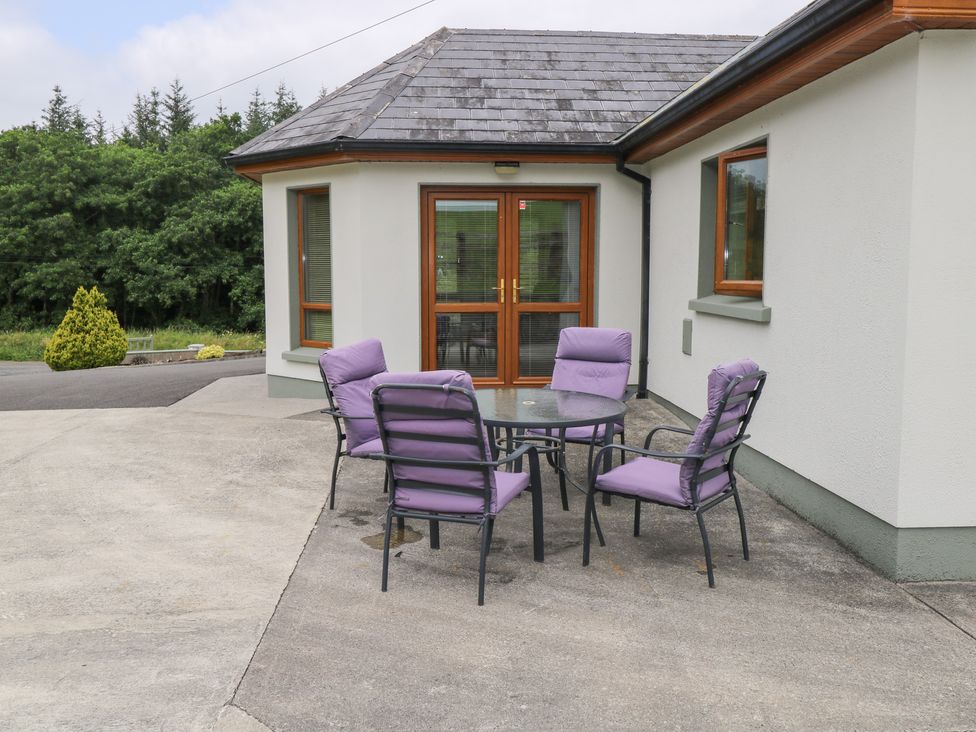 An outdoor seating area with a table and chairs at Swan Lake in Cloonshaghan near Boyle, County Roscommon