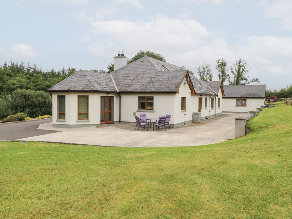 A house with patio and chairs at Swan Lake in Cloonshaghan near Boyle, County Roscommon