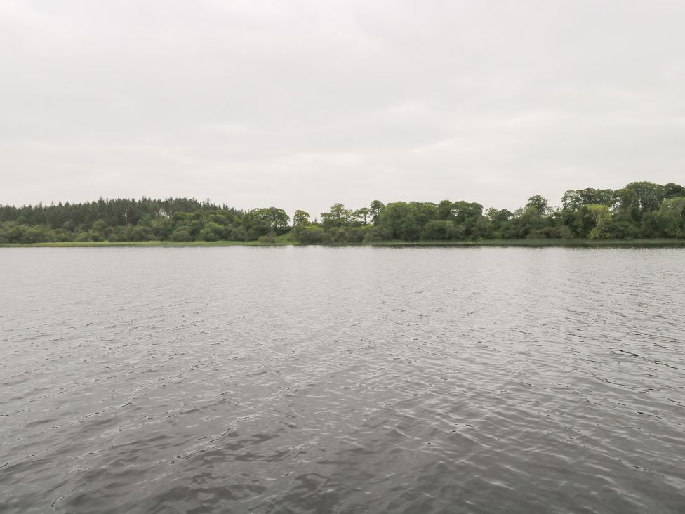A body of water with trees along the shoreline at Swan Lake in Cloonshaghan near Boyle, County Roscommon