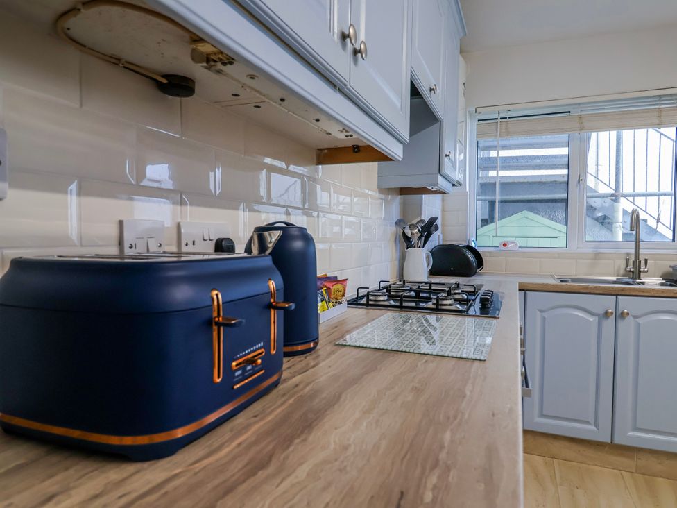 A kitchen with a kettle and toaster at Sea Lovers in Exmouth