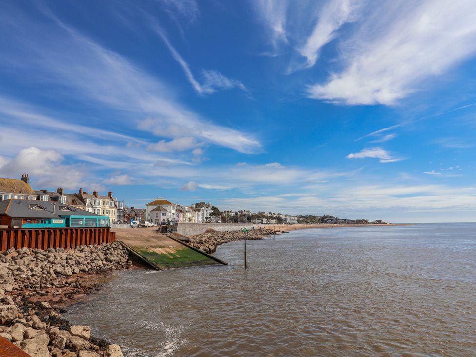 A view of the seafront with water and buildings at Sea Lovers in Exmouth