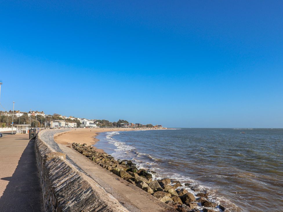 A beach view with a path and buildings at Sea Lovers Exmouth