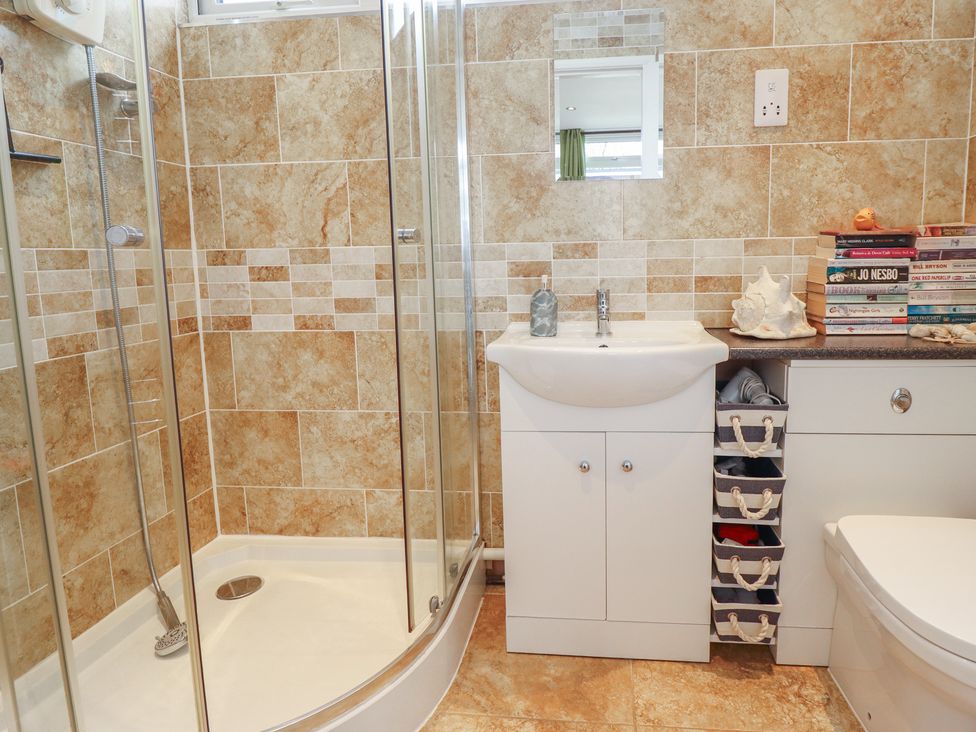 A bathroom with a sink and shower at Seaside Retreat near Chapel Point near Chapel St Leonards