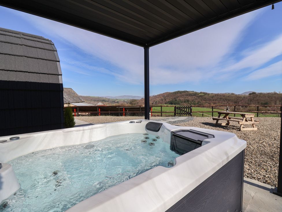 A hot tub with a view at Lili Wen Fach in Ruthin