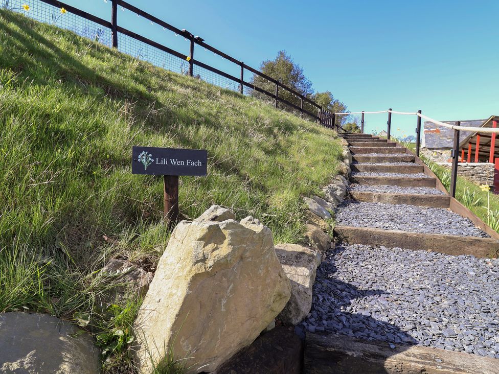 Stairs leading to a sign reading Lili Wen Fach at Lili Wen Fach in Ruthin