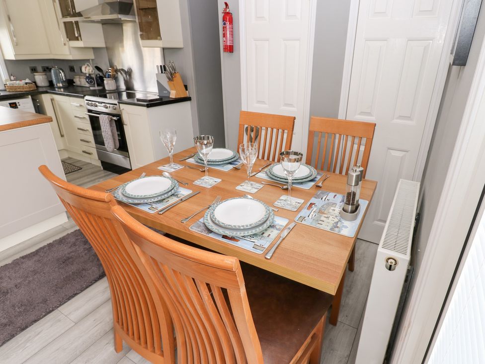 A dining area with a table set for four at A and C Lodge-Plot 21 Armathwaite