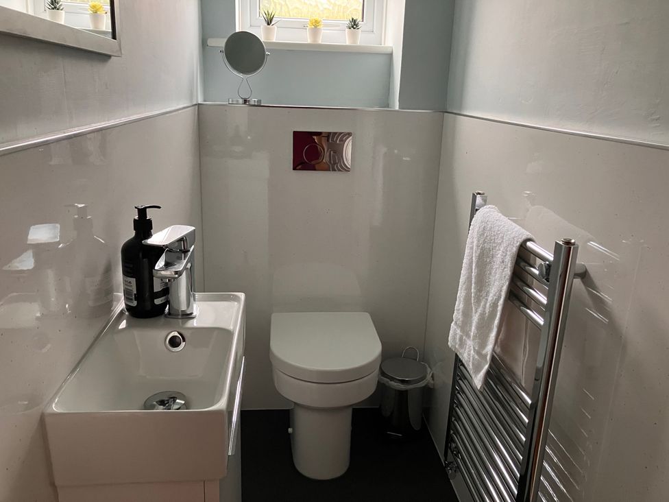 A bathroom with a toilet and sink at Glyde House in Dorchester