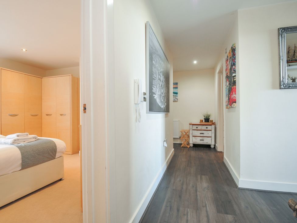 A hallway with a view of a bedroom at Whitewater Seaview in Newquay