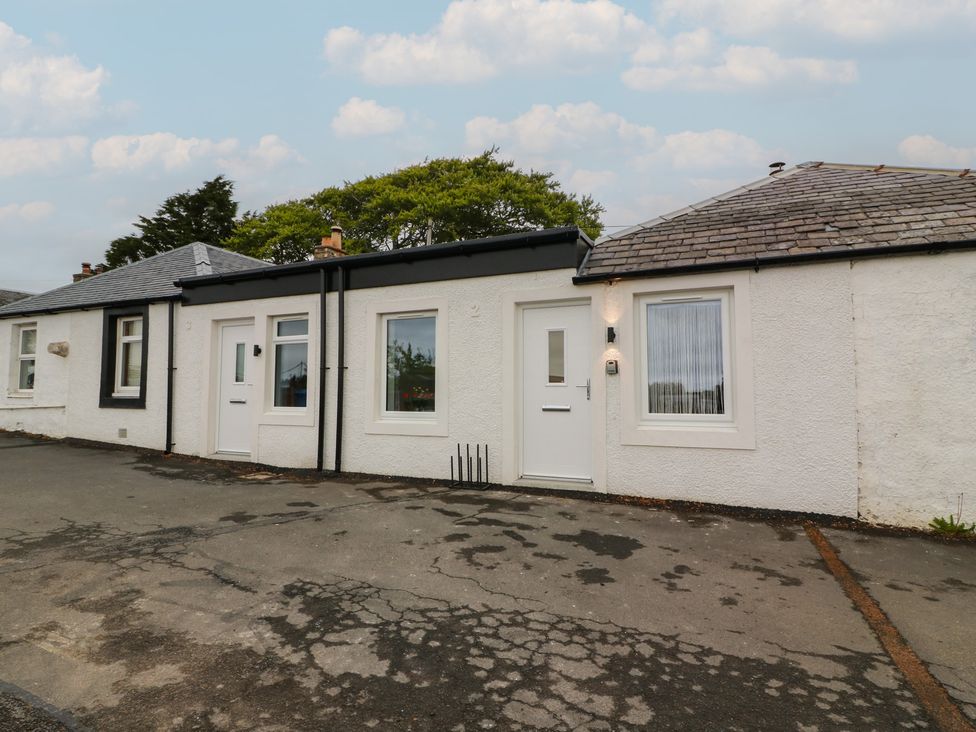 A cottage with front door and windows at Rosalin Cottage Dreghorn near Irvine