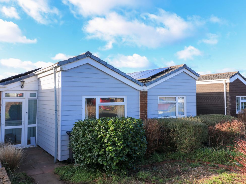 A house with windows and bushes at Awalek, Cumber Close Malborough