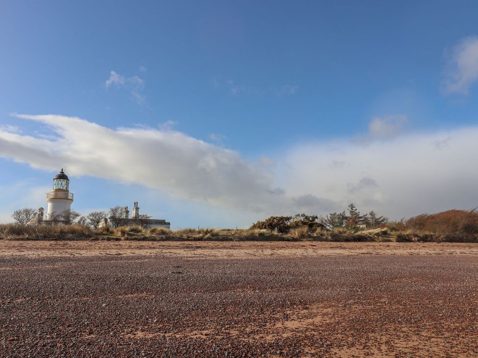 A lighthouse near a beach at Taffs Barn Fortrose near Rosemarkie