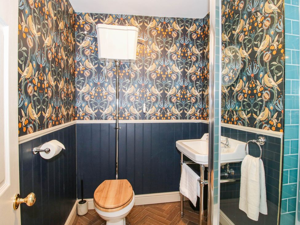 A bathroom with a toilet and sink at The Lodge in Shawbury