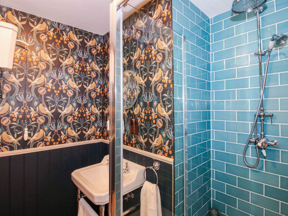 A bathroom with a sink and shower at The Lodge in Shawbury