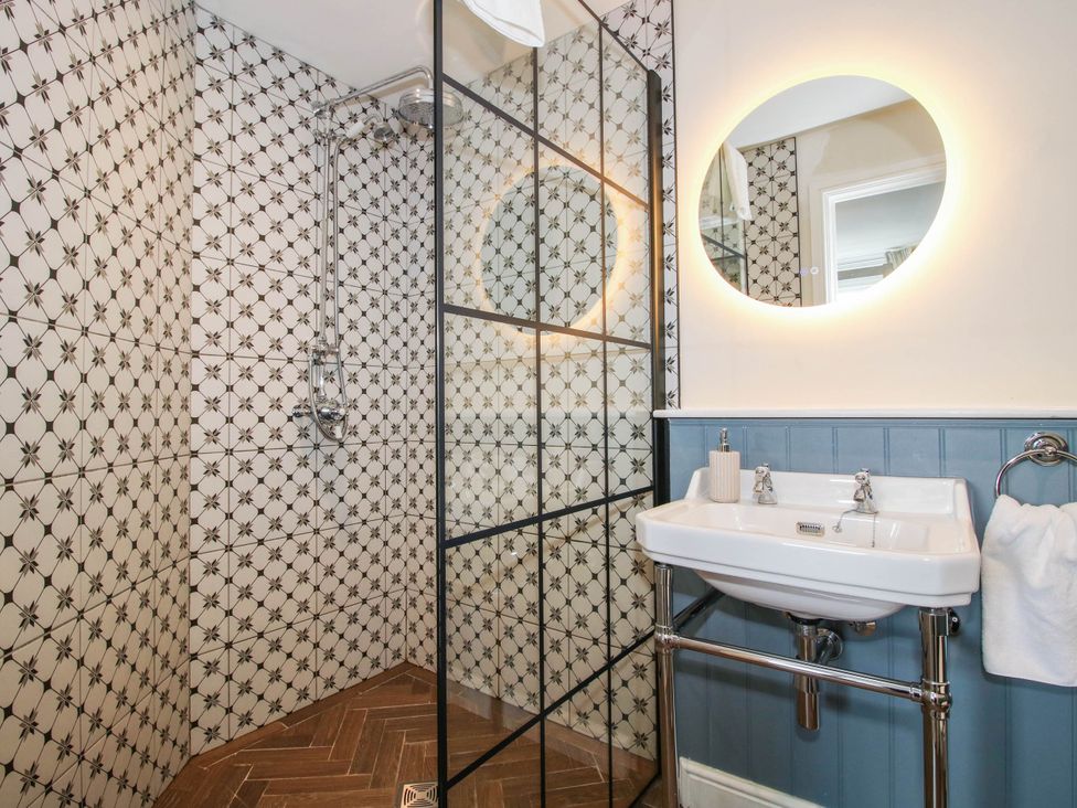 A bathroom with a shower and sink at The Lodge in Shawbury
