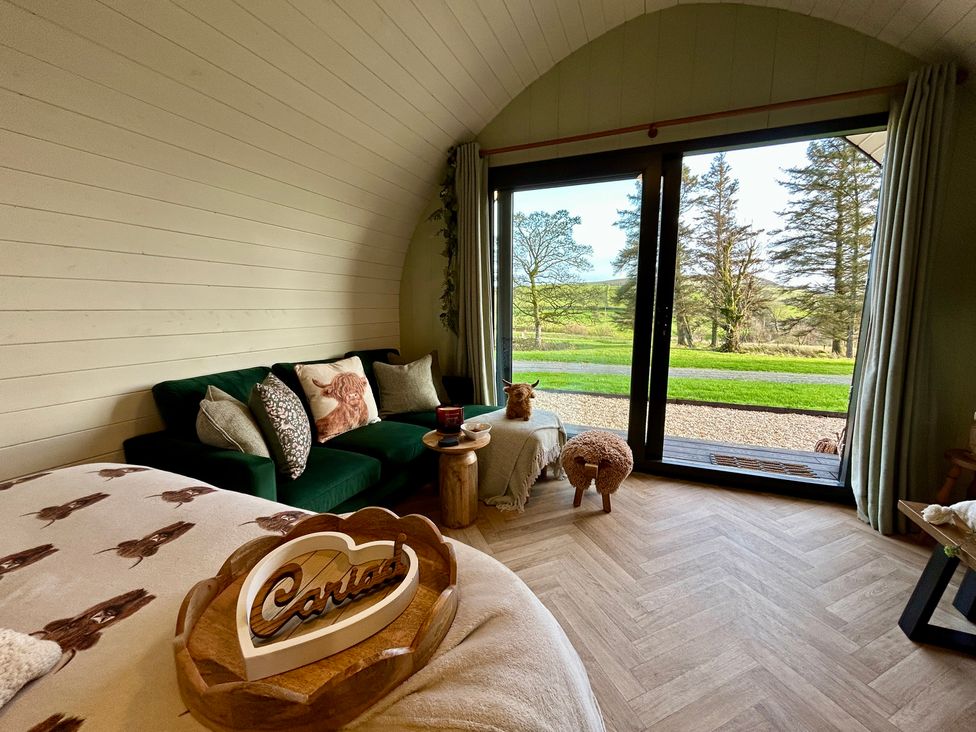 A living room with a sofa and coffee table at Willow in Llangurig near Llanidloes