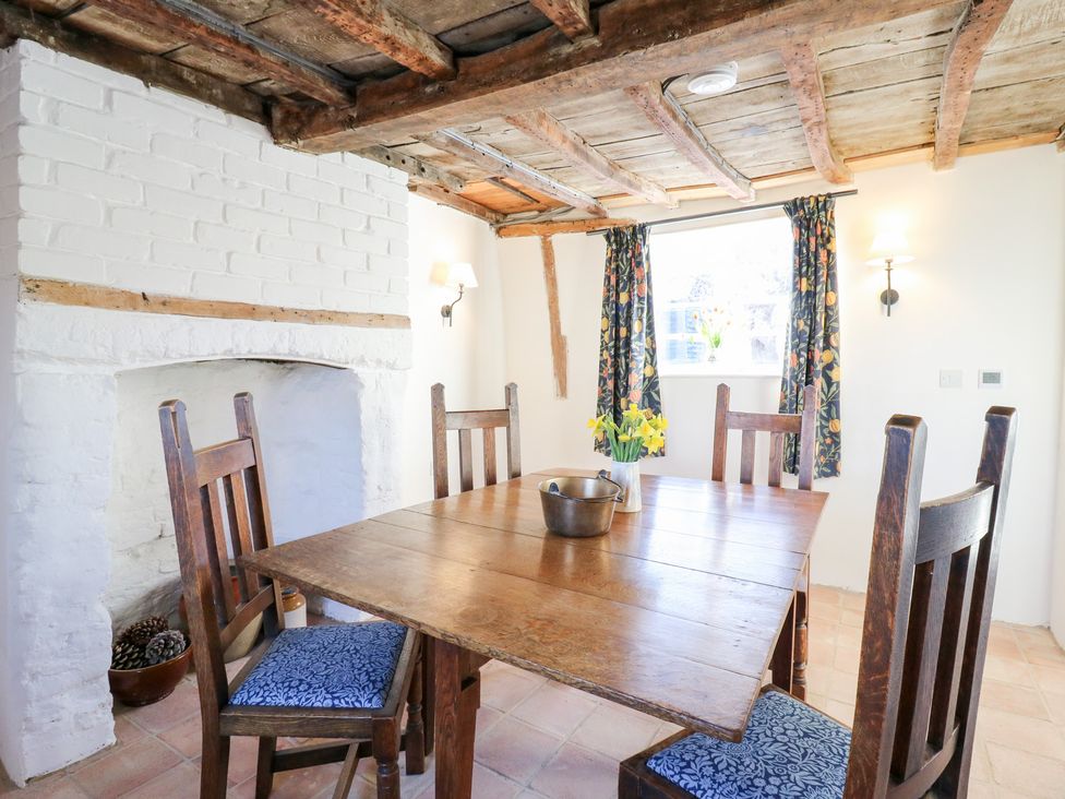 A dining room with a wooden table and chairs at 66 High Street, Cambridge