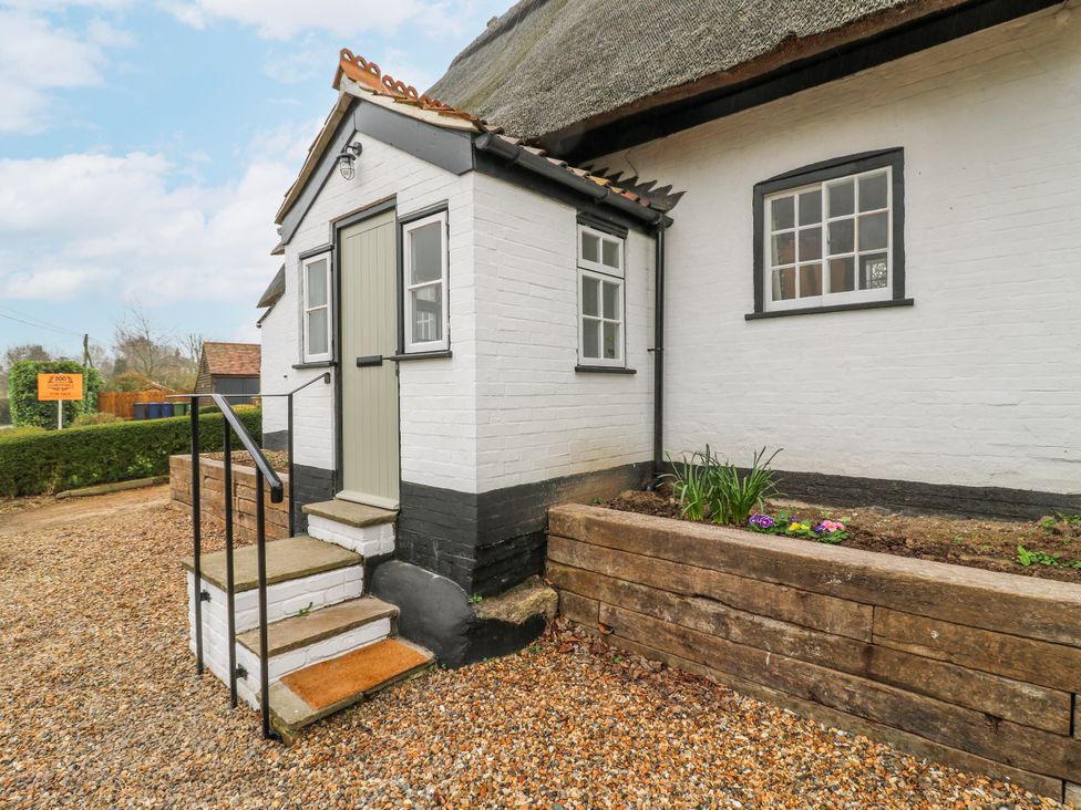 An outdoor entrance with steps and planting area at The Old Smithy in Bourn