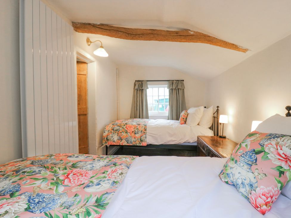 A bedroom with two beds at The Old Smithy in Bourn