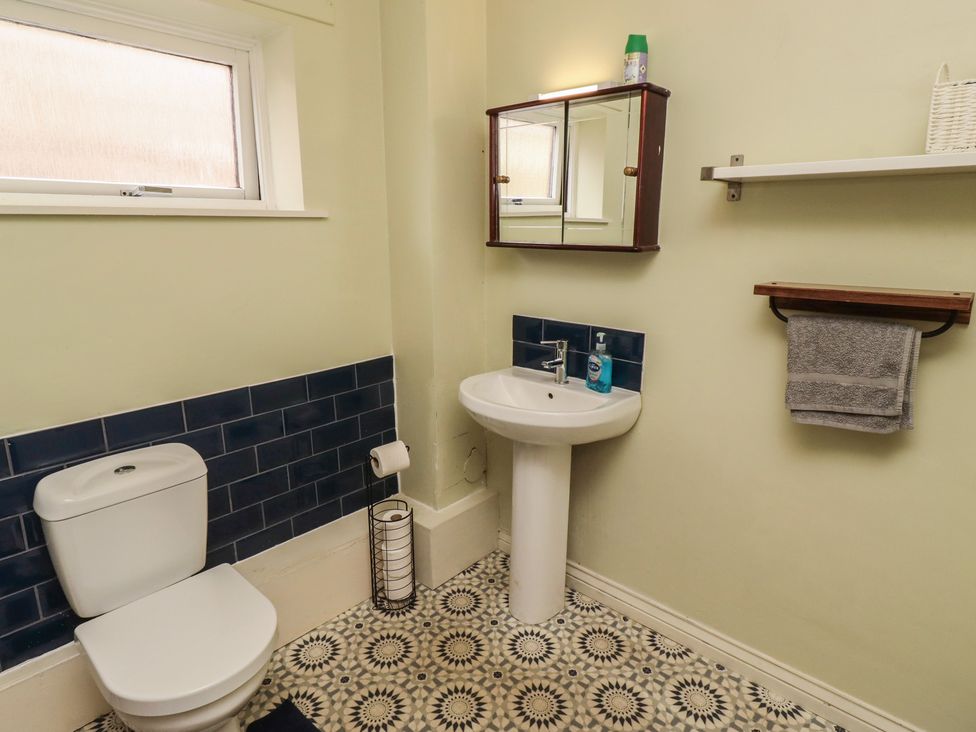 A bathroom with a sink and toilet at Flodden Apartment in Wooler