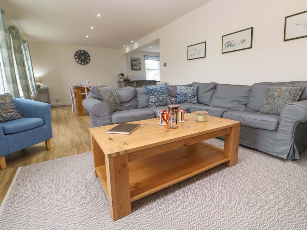 A living room with a coffee table and sofa at Fair View St Just in Roseland near St Mawes