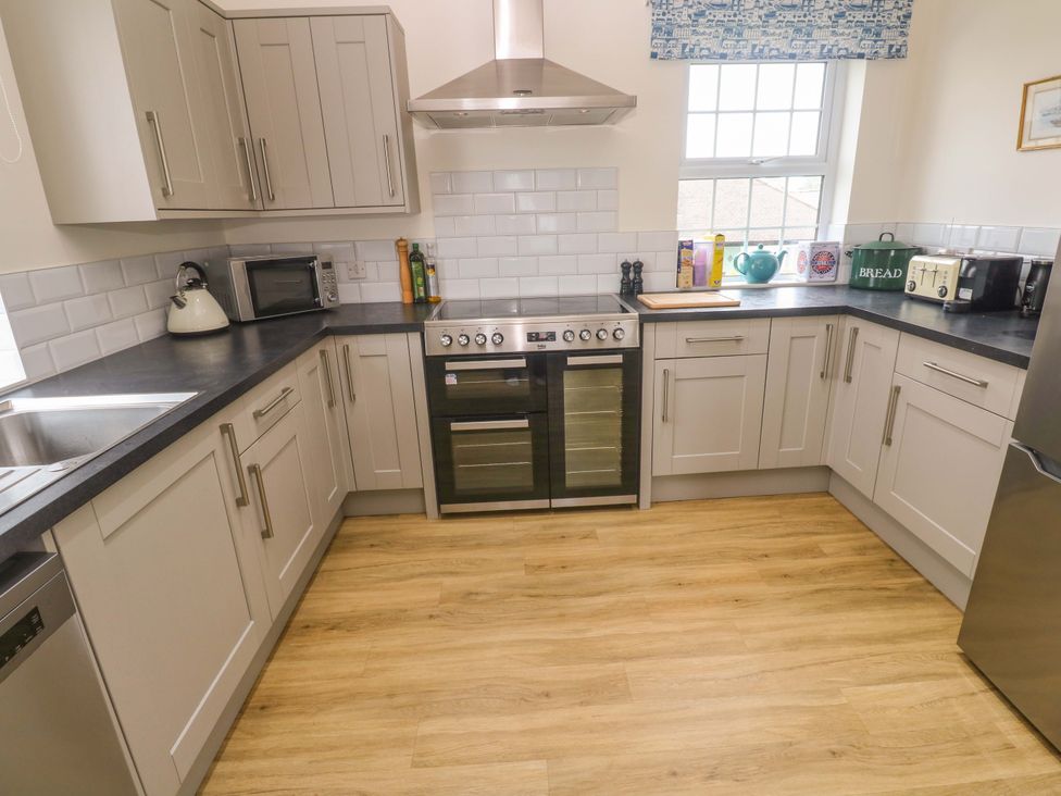 A kitchen with appliances and utensils at Fair View St Just in Roseland near St Mawes