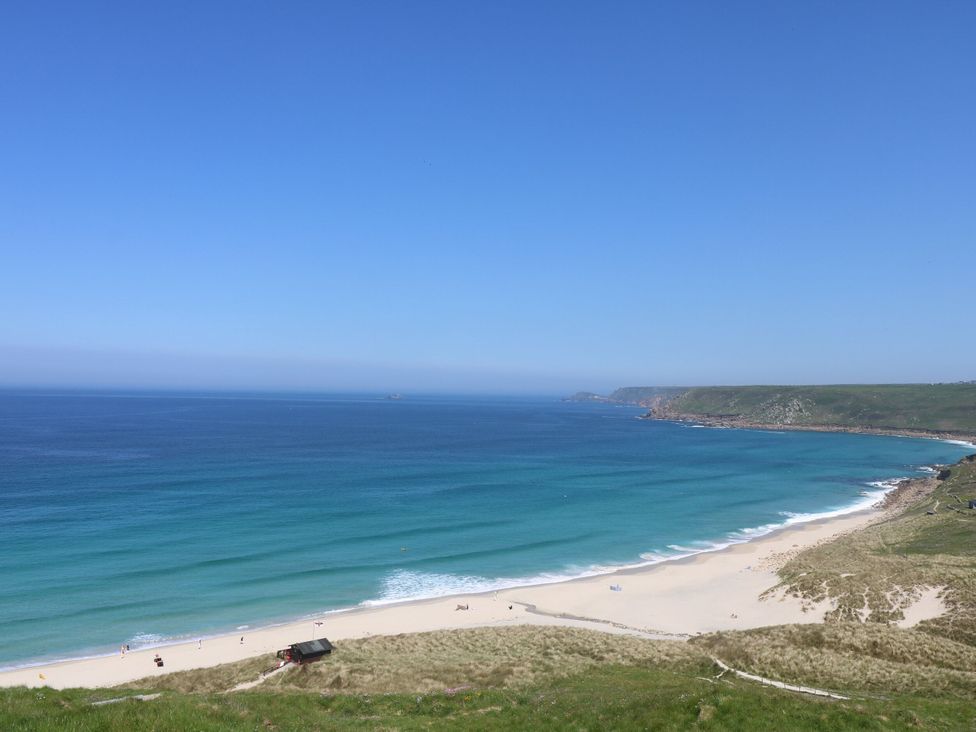 A beach view with sand and ocean at Fair View in St Just in Roseland near St Mawes