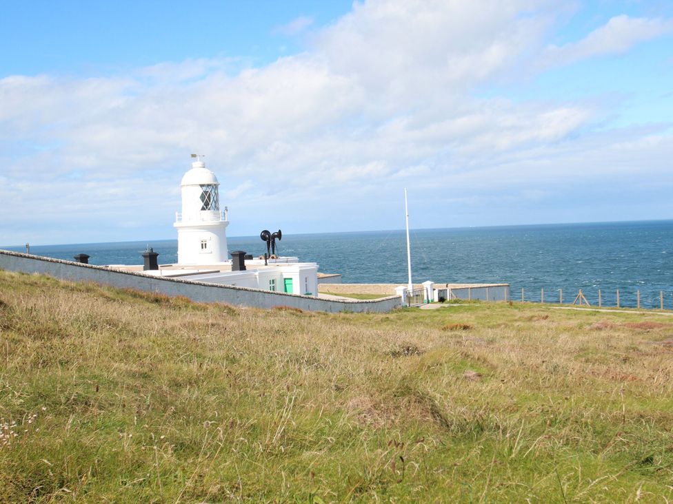 A lighthouse near the ocean at Fair View St Just in Roseland near St Mawes