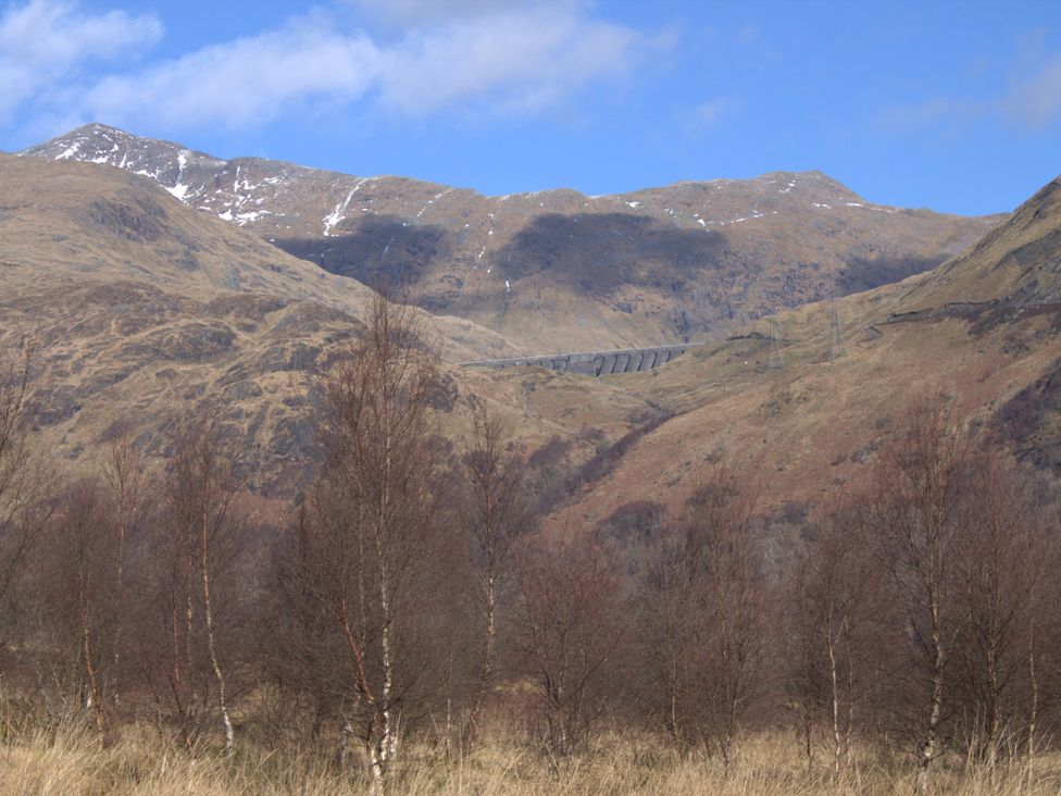Mountains with trees and a road at Taigh Creag Thulach in Taynuilt