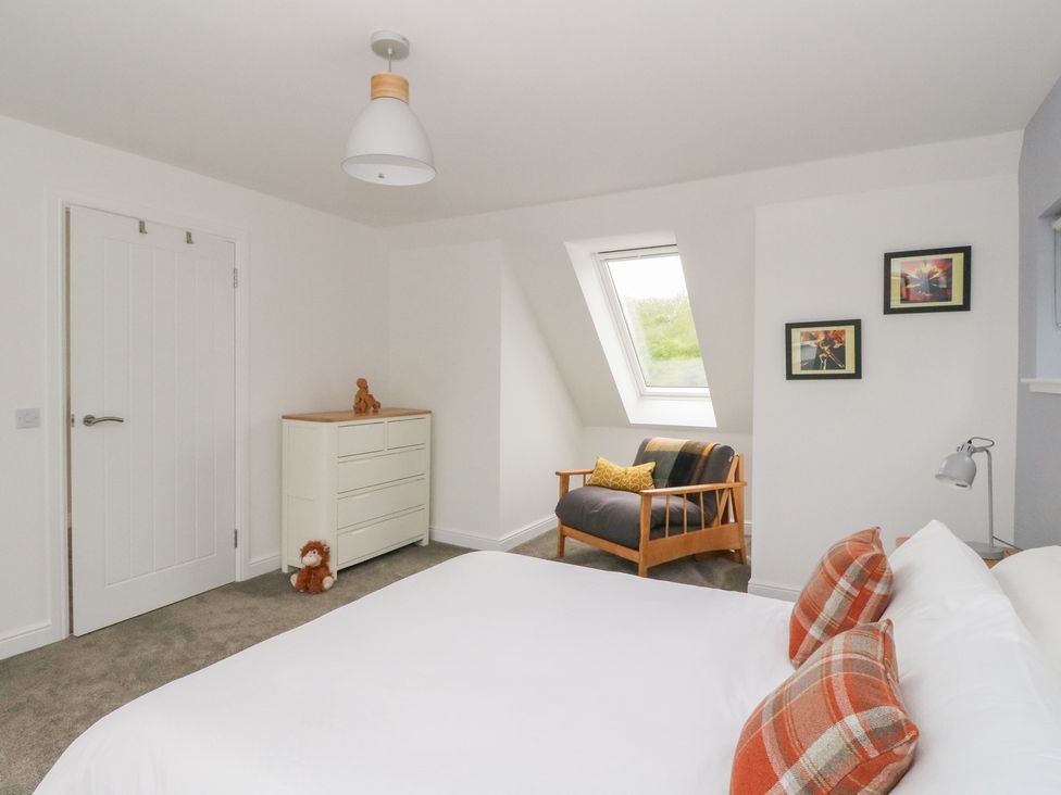 A bedroom with a bed and a dresser at Taigh Creag Thulach in Taynuilt