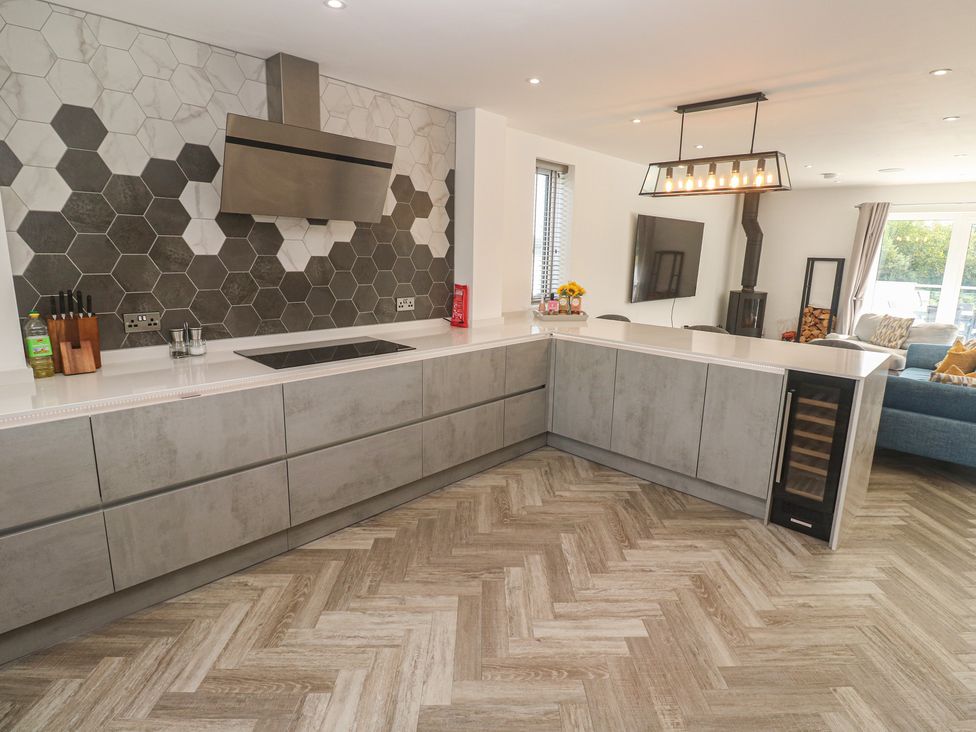 A kitchen with a countertop and appliances at Carnon Gwel, Devoran