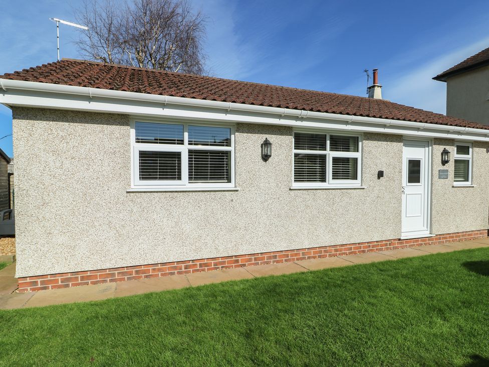 A building with windows and a door at Trillo Lodge in Colwyn Bay