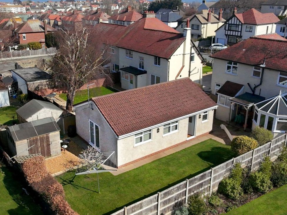 An outdoor area with houses and a garden at Trillo Lodge Rhos-On-Sea