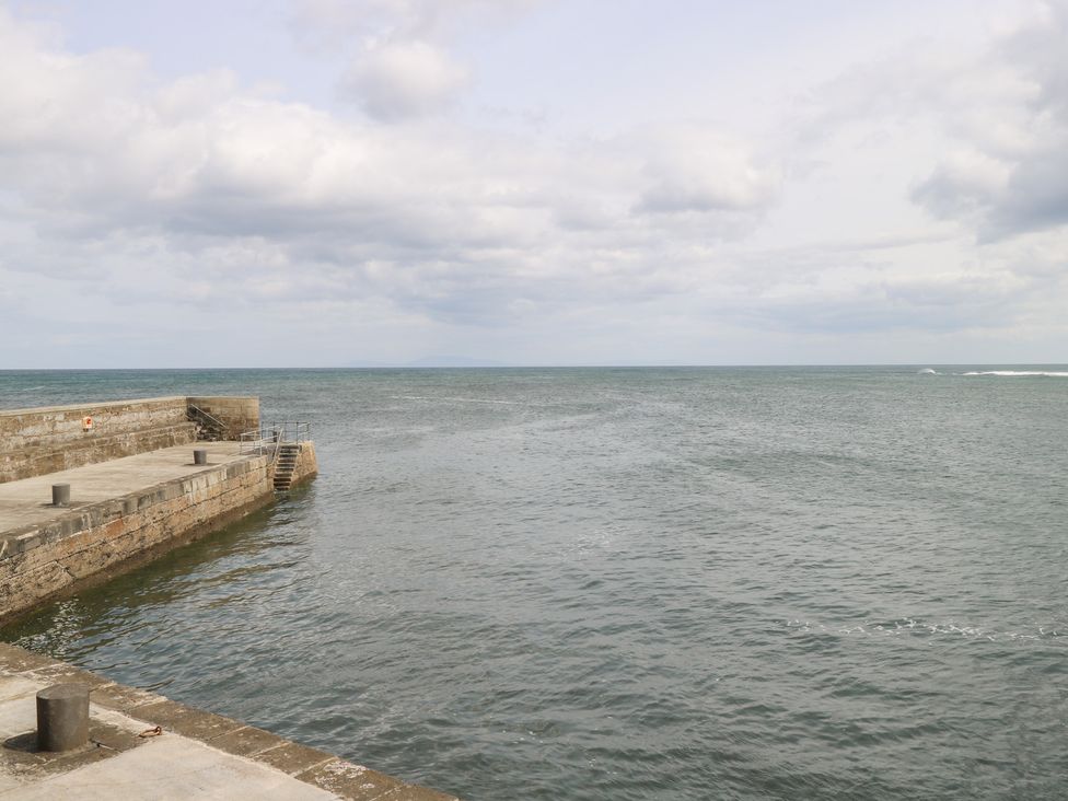 A view of a pier extending into the ocean at Doonalton House in Dromore West, County Sligo