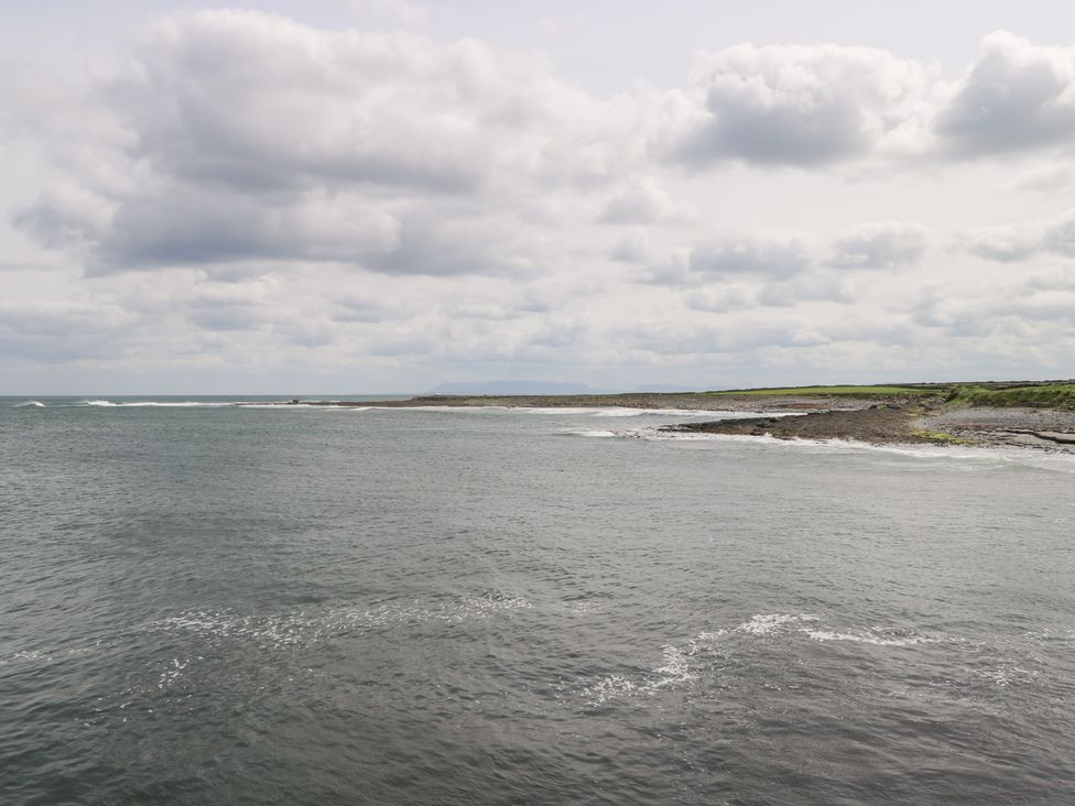 View of the ocean and shoreline with clouds in the sky at Doonalton House Dromore West County Sligo