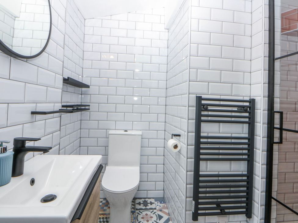 A bathroom with a sink and toilet at East meets West in Criccieth