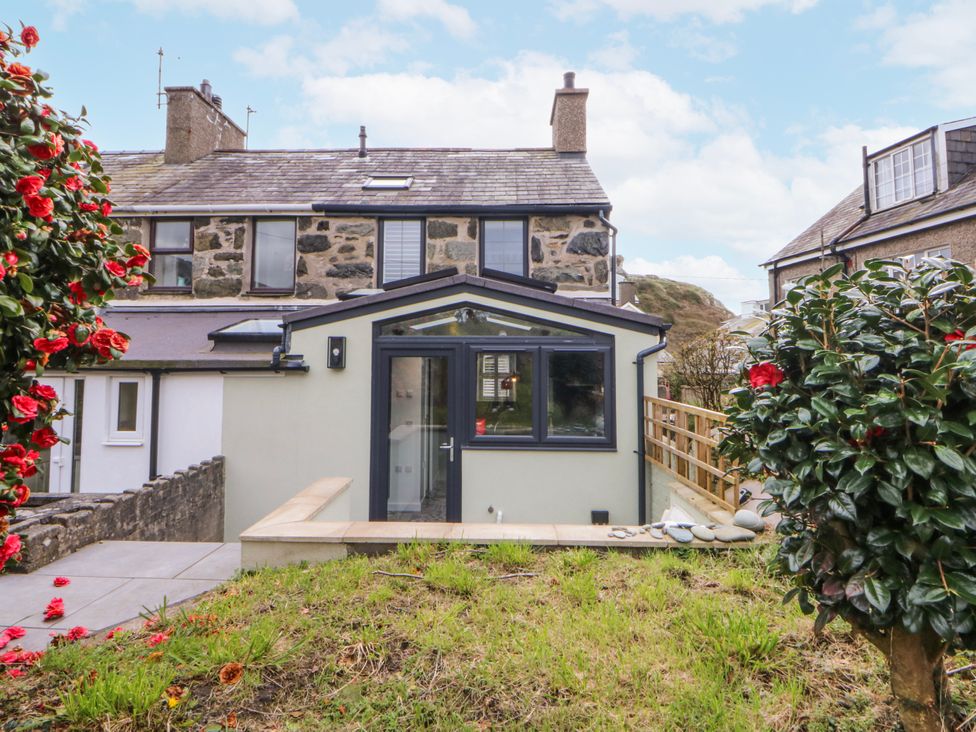 A house with garden and pathway at East meets West Criccieth