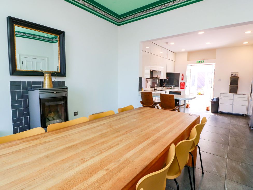 A kitchen with a table and chairs at Altafearn in Tighnabruaich
