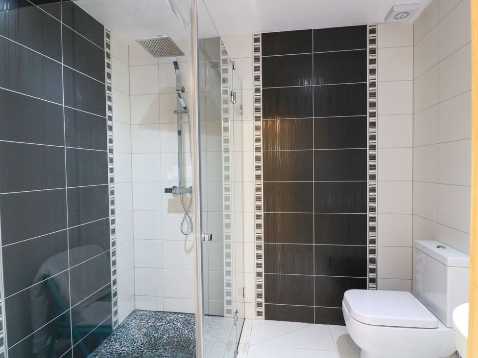 A bathroom featuring a shower and toilet at Altafearn in Tighnabruaich
