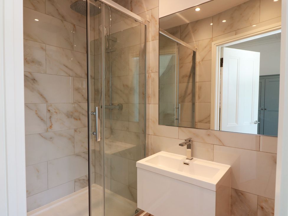 A bathroom with a shower and sink at Altafearn in Tighnabruaich