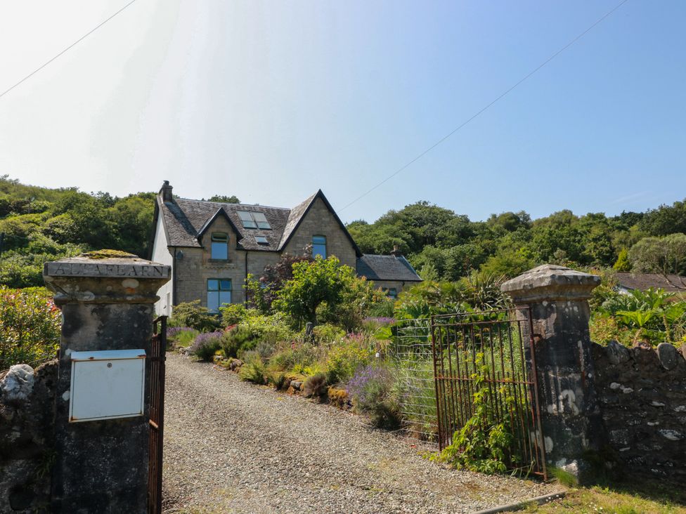 A house with a garden and driveway at Altafearn in Tighnabruaich