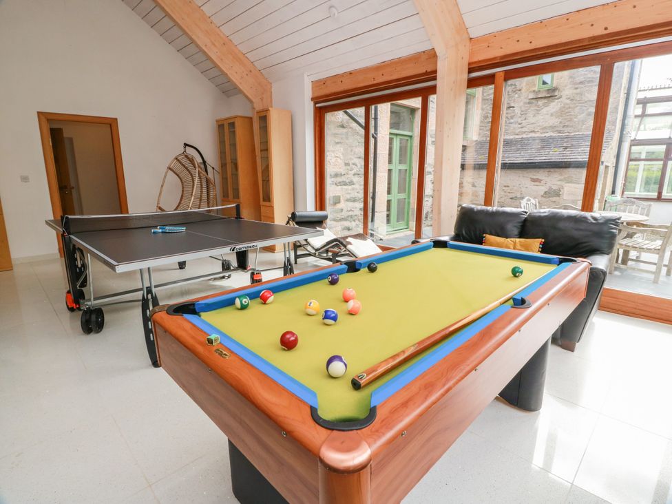 A snug with a pool table and ping pong table at Altafearn Kames