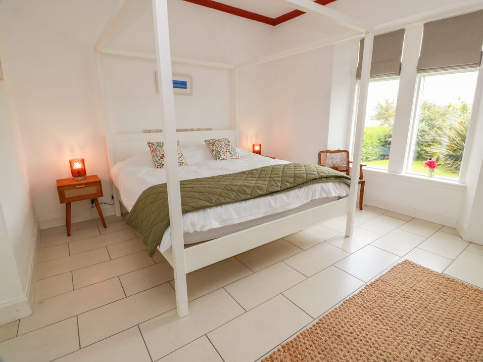 A bedroom with a bed and nightstand at Altafearn in Kames