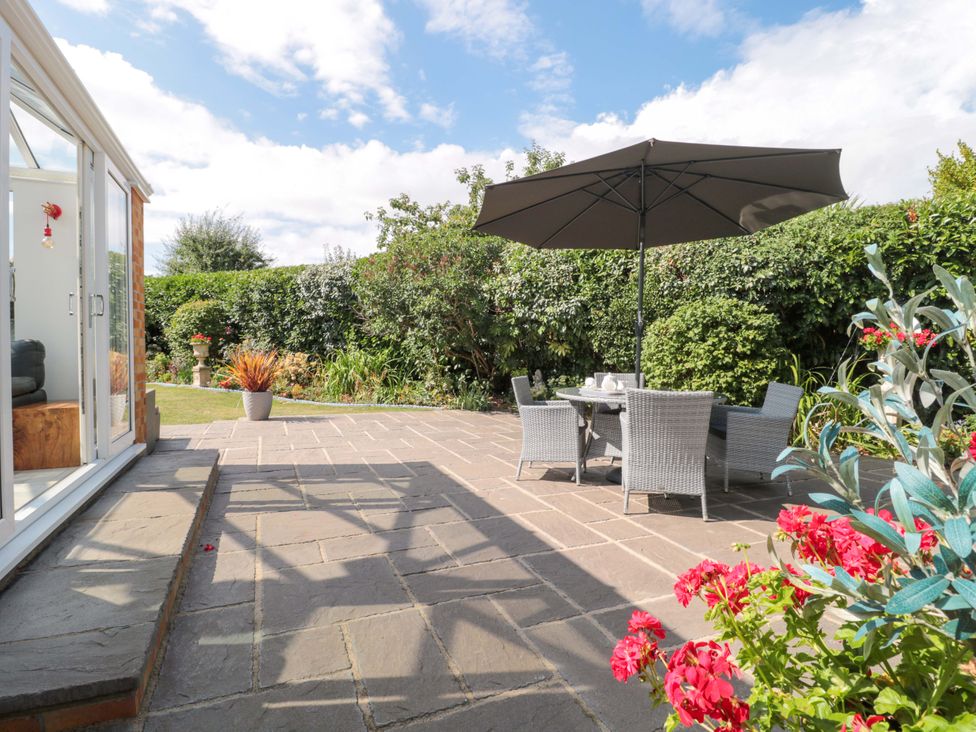 A garden with patio furniture and plants at No 8 Burnham-on-Sea