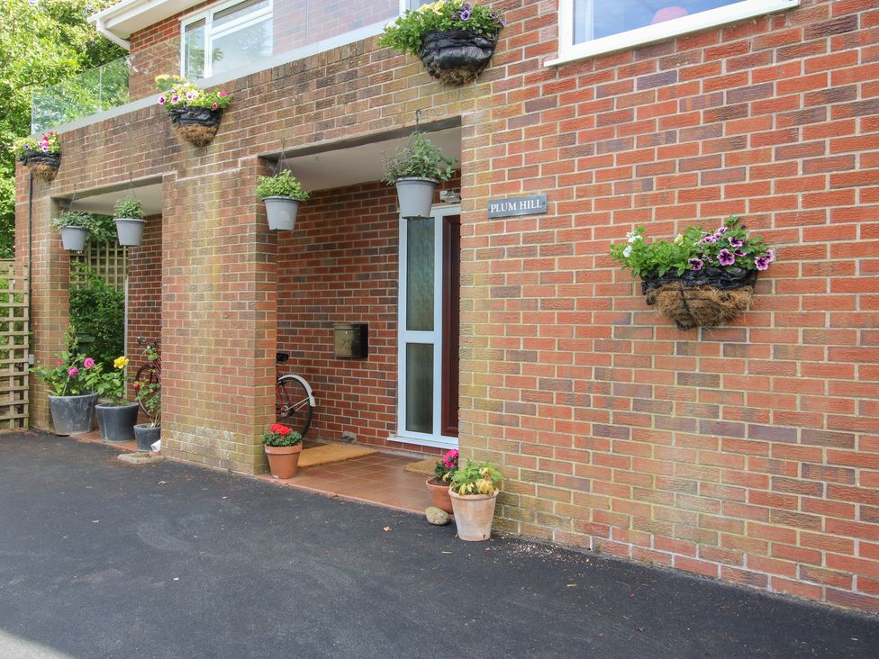 An outdoor area with a door and planters at Plum Hill in Morda, near Oswestry