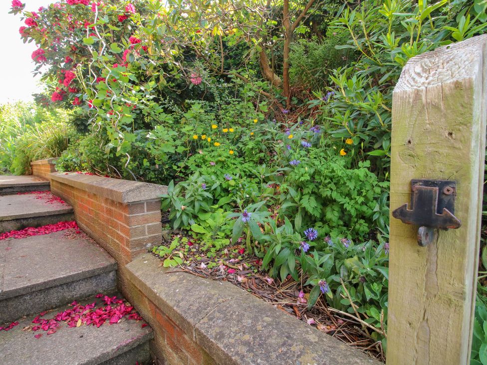 A garden with stairs and flower beds at Plum Hill in Morda, near Oswestry