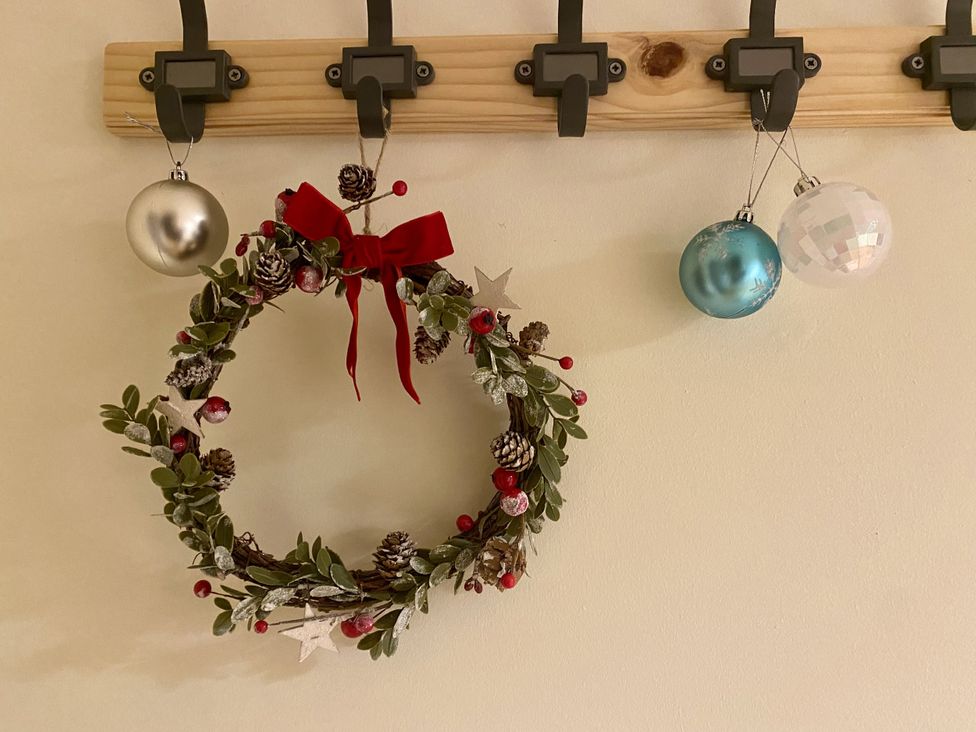 A wreath and Christmas ornaments on a hook at Betty's Farm Cottage, Lack near Ederney, County Fermanagh
