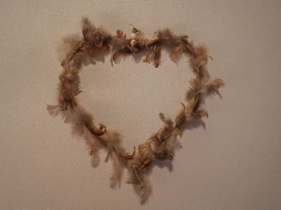A heart-shaped decoration made of feathers and twine at The Hoot in Great Finborough near Stowmarket