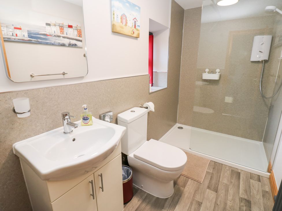 A bathroom featuring a sink, toilet, and shower at Stoneleigh Cottage in Muker